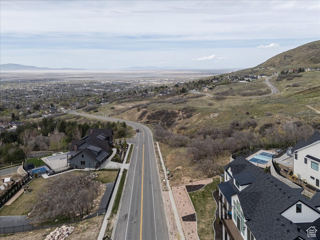 Aerial view of property's location with a mountainous background