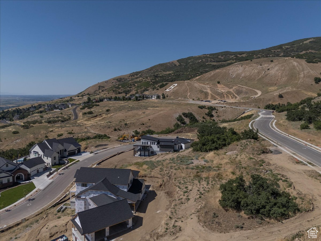 View of property location featuring a mountainous background and nearby suburban area