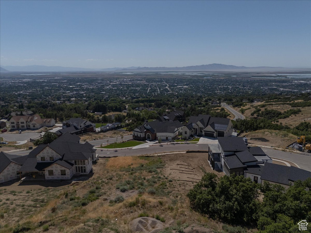 Aerial perspective of suburban area with a mountain backdrop
