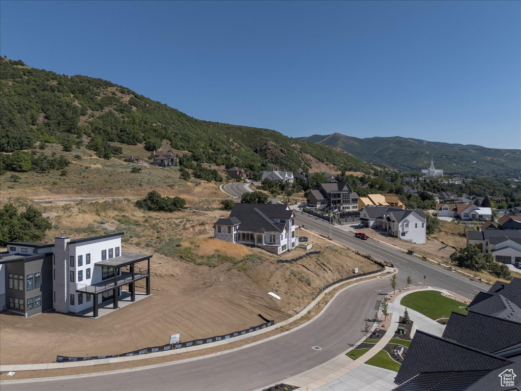 Aerial perspective of suburban area featuring a mountainous background