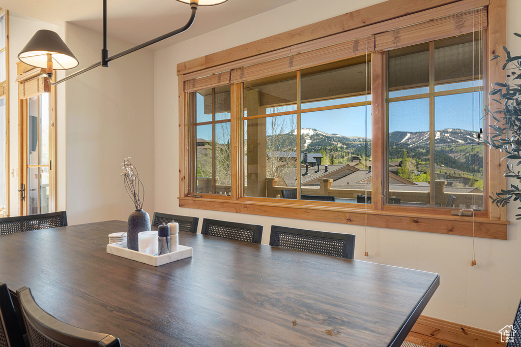 Dining area featuring plenty of natural light and a mountain view