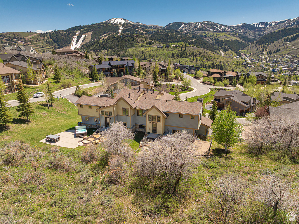 View of mountain backdrop featuring nearby suburban area