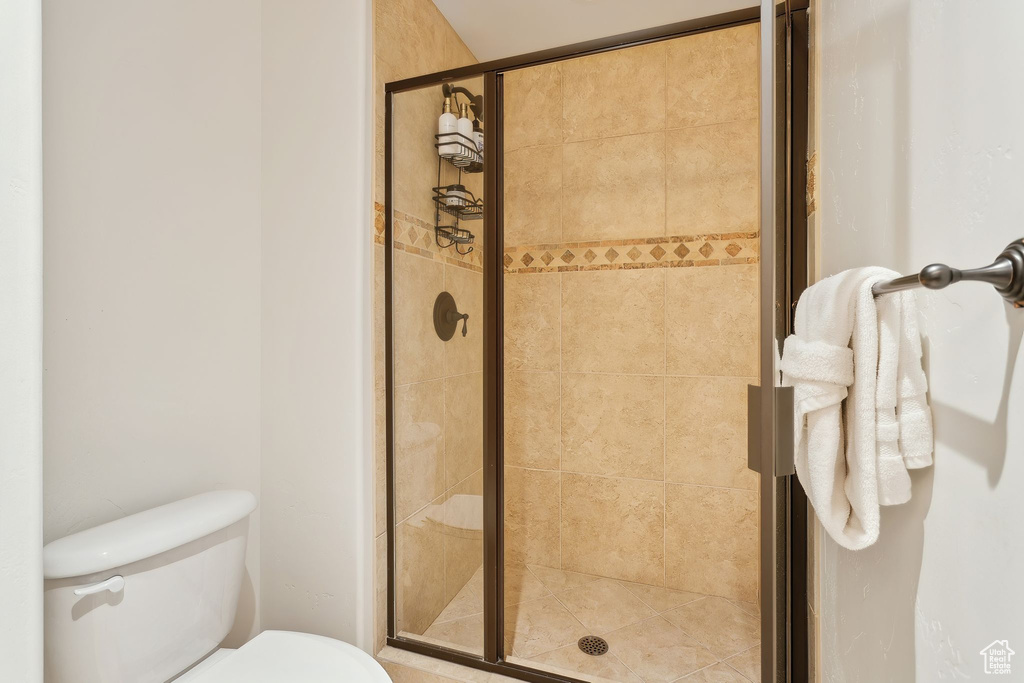 Bathroom with toilet and an enclosed shower