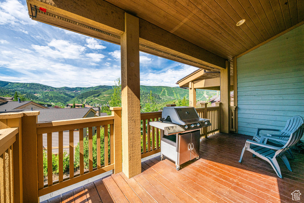 Deck with area for grilling and a mountain view