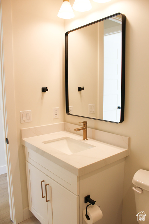 Bathroom with vanity and toilet