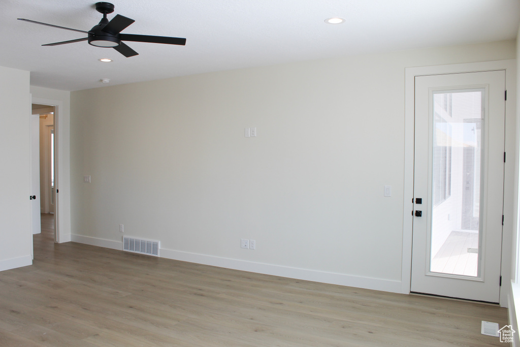 Spare room with light hardwood / wood-style flooring and ceiling fan