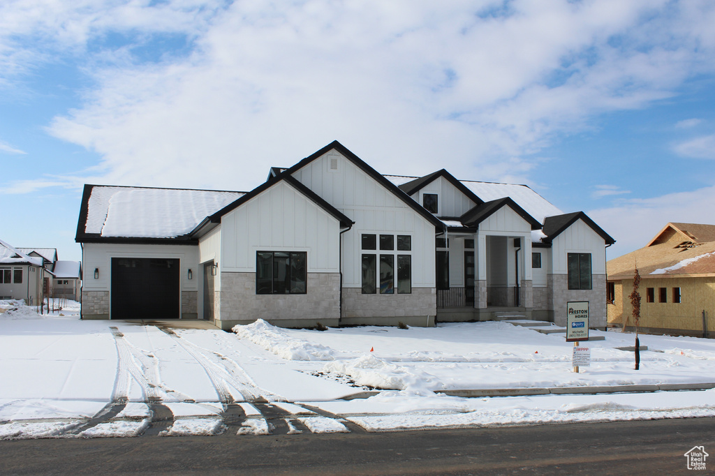 View of front of property featuring a garage