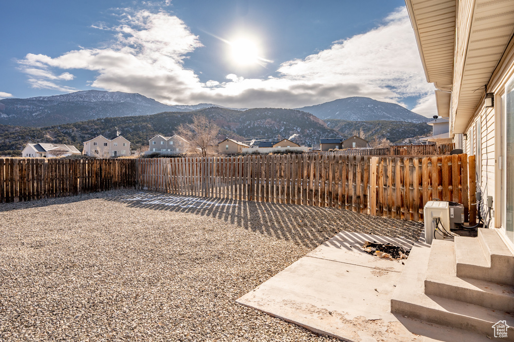 View of yard featuring a mountain view and a patio
