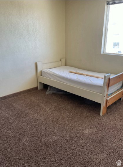 Unfurnished bedroom with carpet