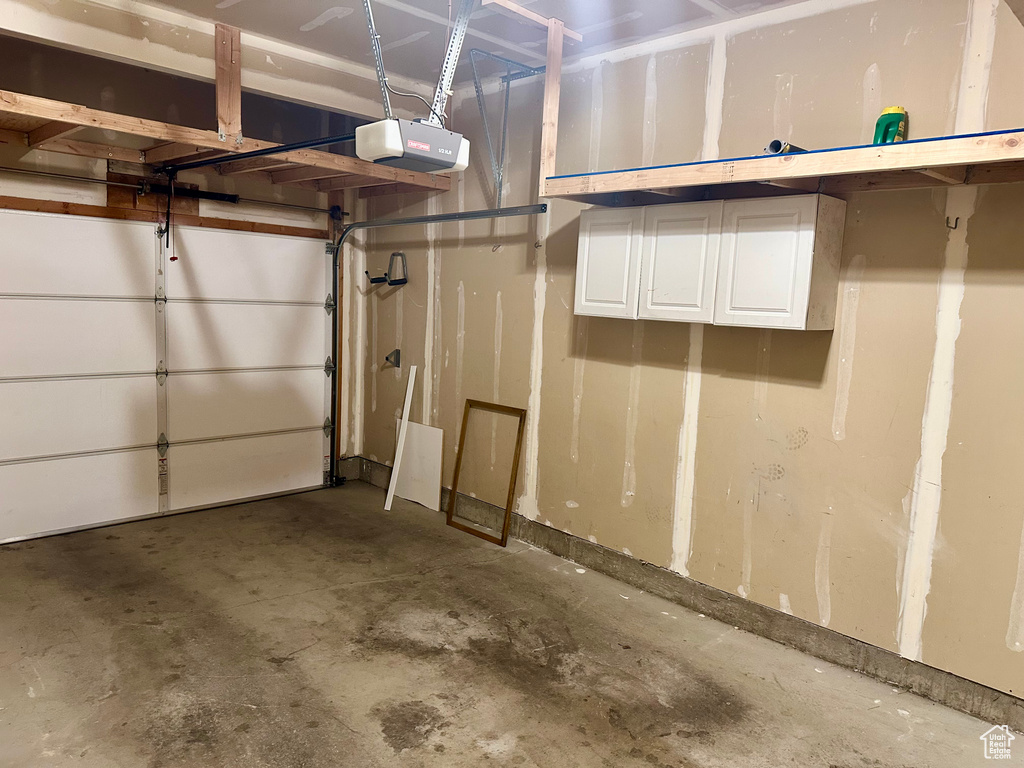 Garage featuring a garage door opener