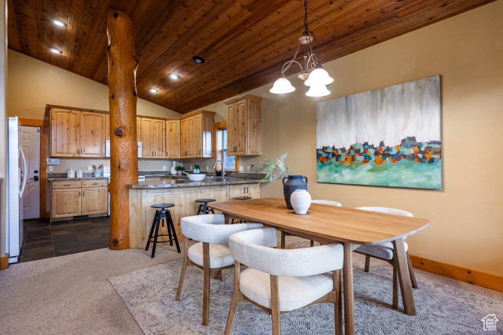 Dining room with wooden ceiling, dark colored carpet, lofted ceiling, a chandelier, and recessed lighting