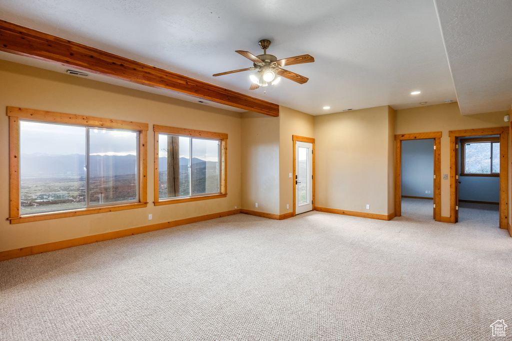 Carpeted spare room with a ceiling fan and recessed lighting