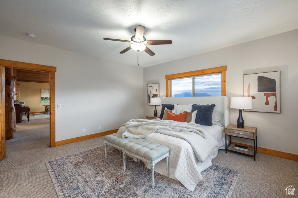 Bedroom with carpet floors and a ceiling fan