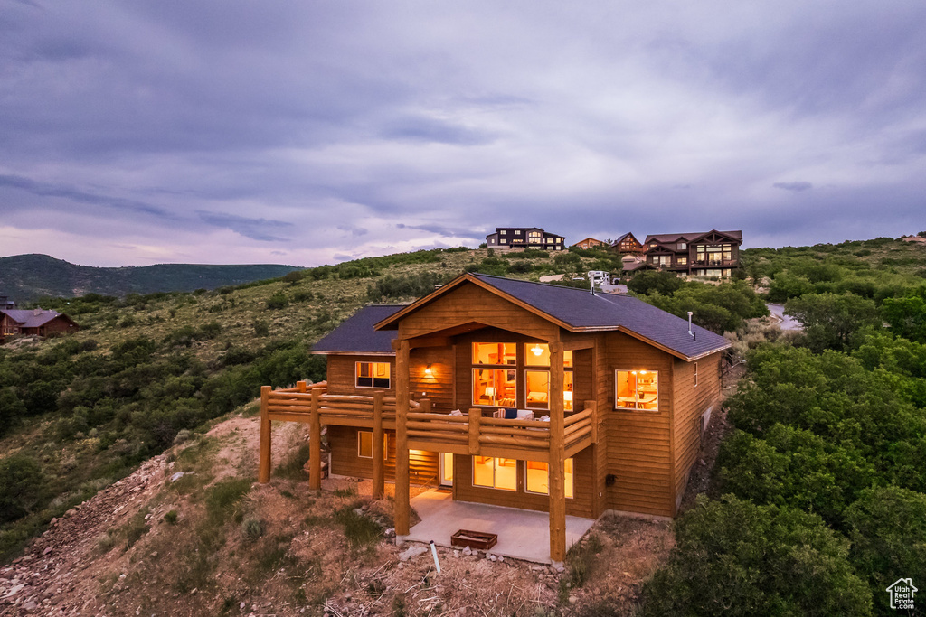 Rear view of property featuring a patio