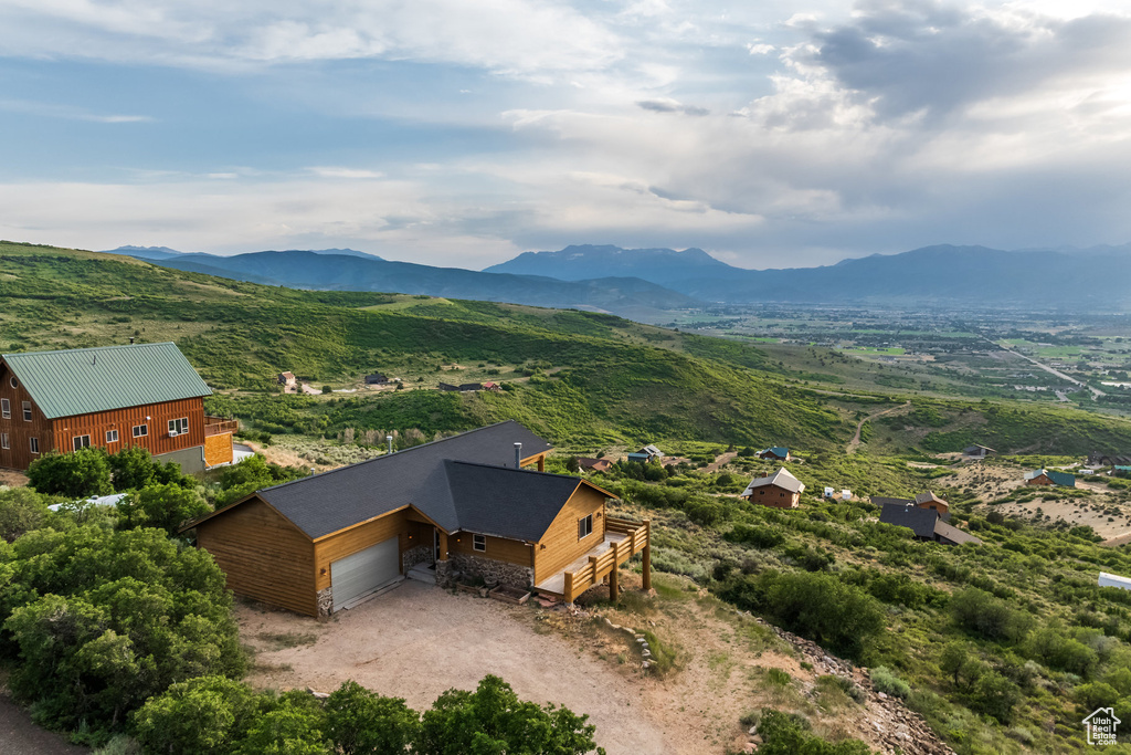 View of subject property with a mountainous background