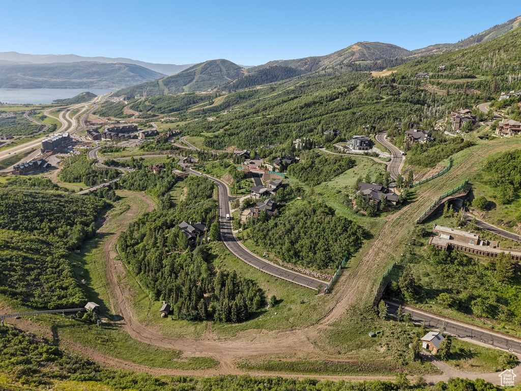 Aerial view of property and surrounding area with mountains