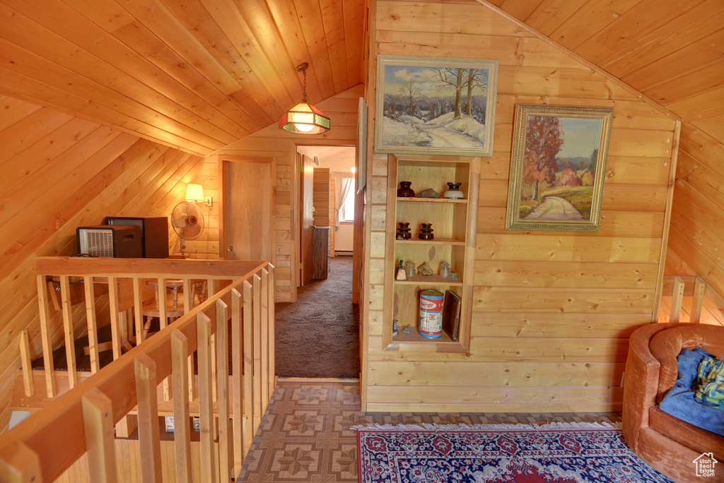 Hall featuring vaulted ceiling and wooden ceiling