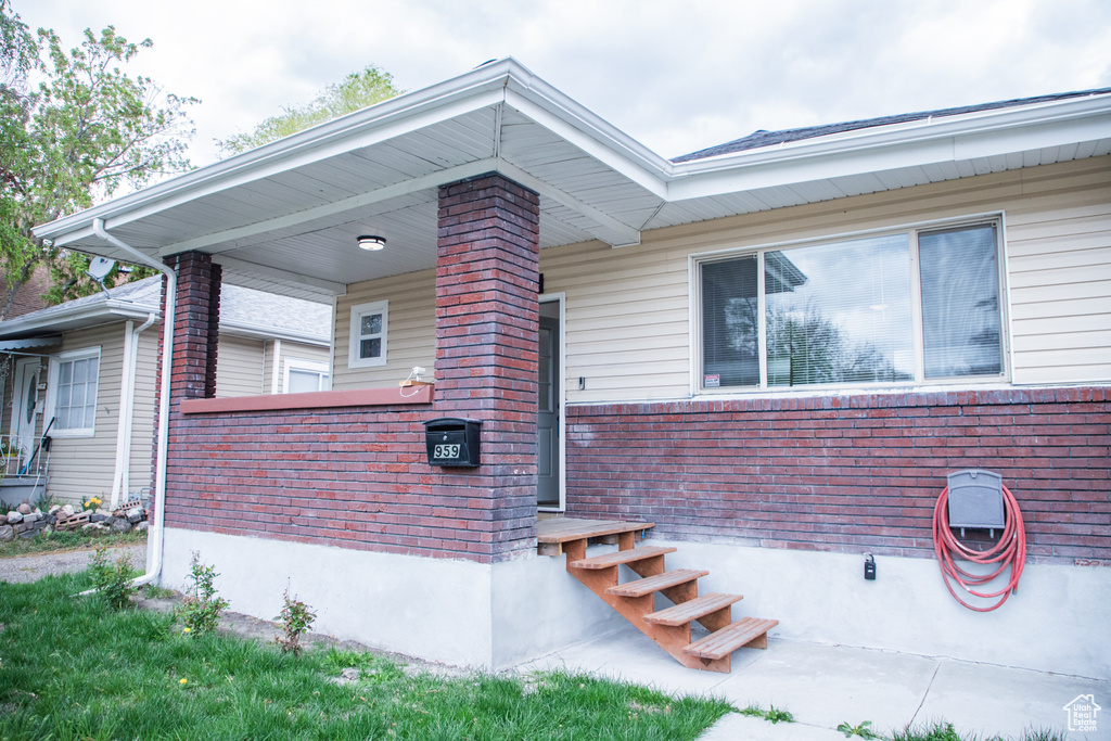 View of front of home featuring brick siding