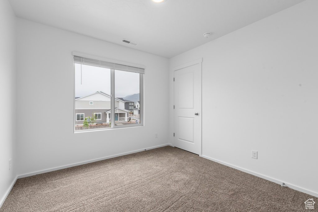 Spare room with carpet floors
