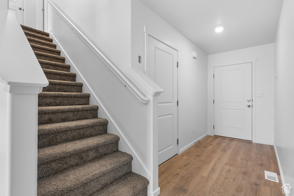 Entryway with hardwood / wood-style floors