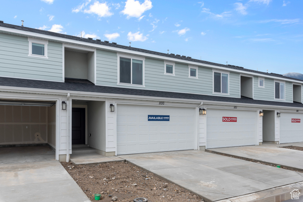View of front of home featuring a garage