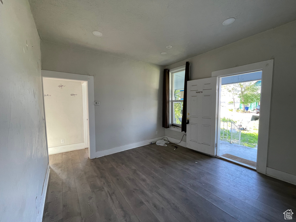 Foyer entrance featuring hardwood / wood-style flooring, baseboards, and recessed lighting