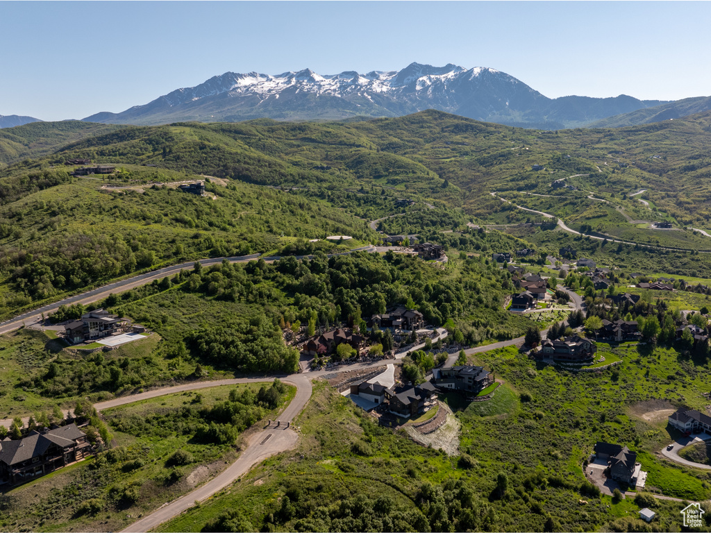Aerial view of property\\\'s location with a mountain backdrop