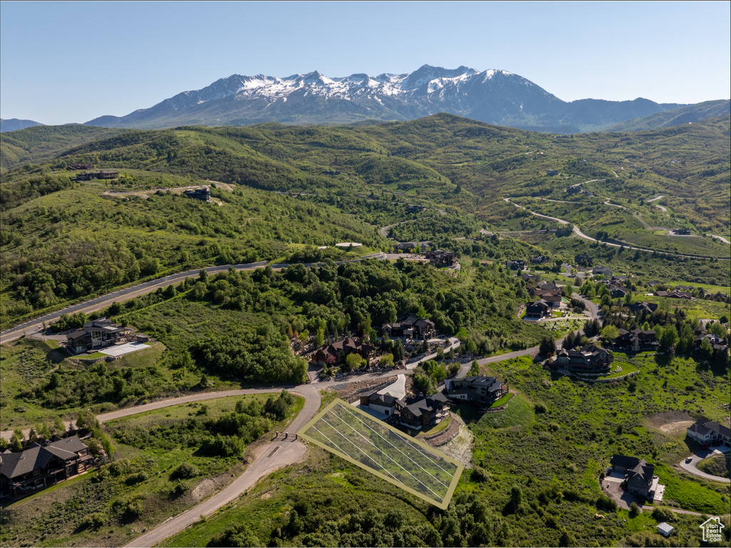 Aerial view of property\\\'s location with a mountain backdrop