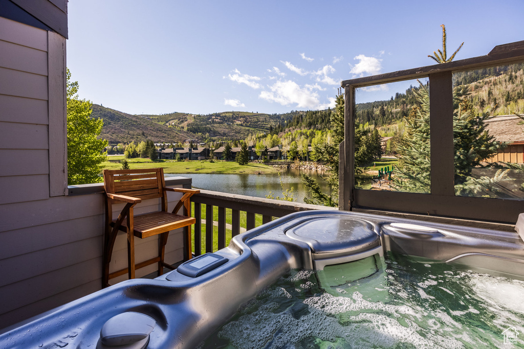 Wooden terrace with a water and mountain view