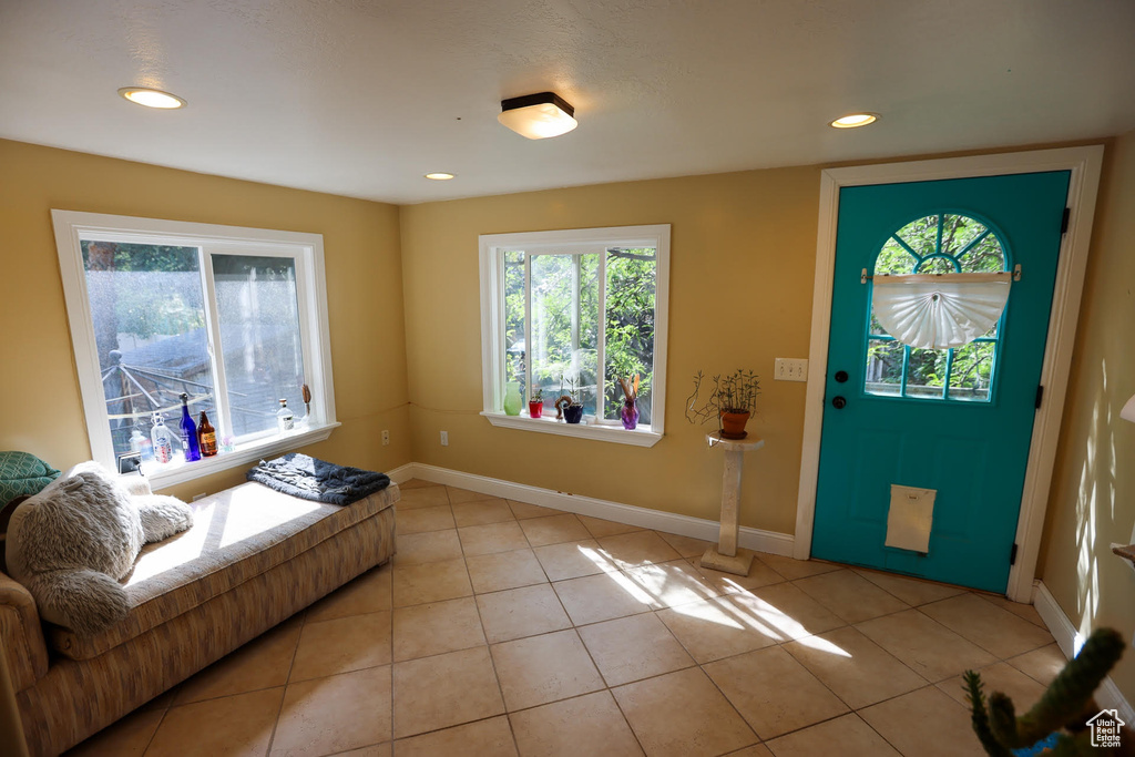Entryway with light tile patterned floors