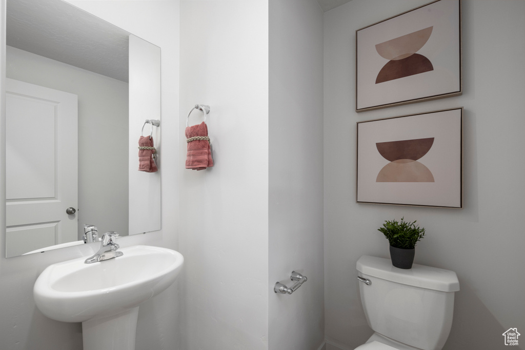 Bathroom with sink and toilet