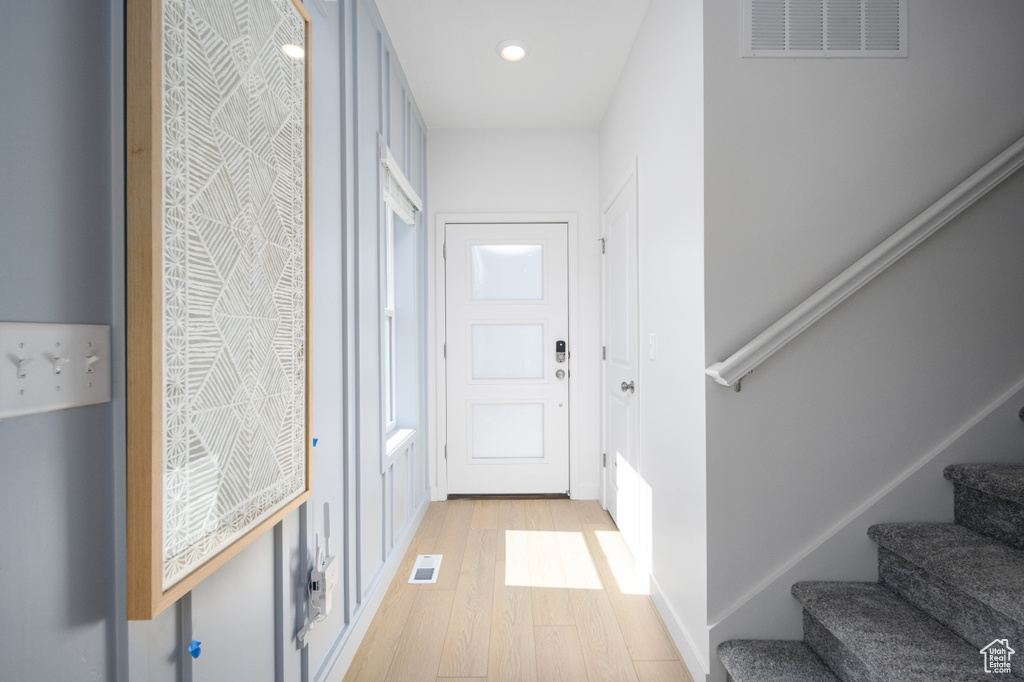 Doorway to outside with light hardwood / wood-style flooring