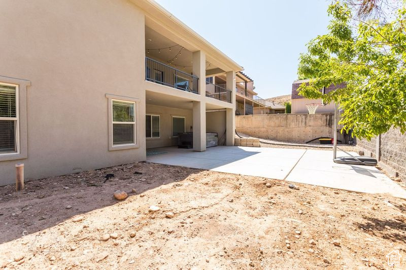 View of side of home featuring a patio