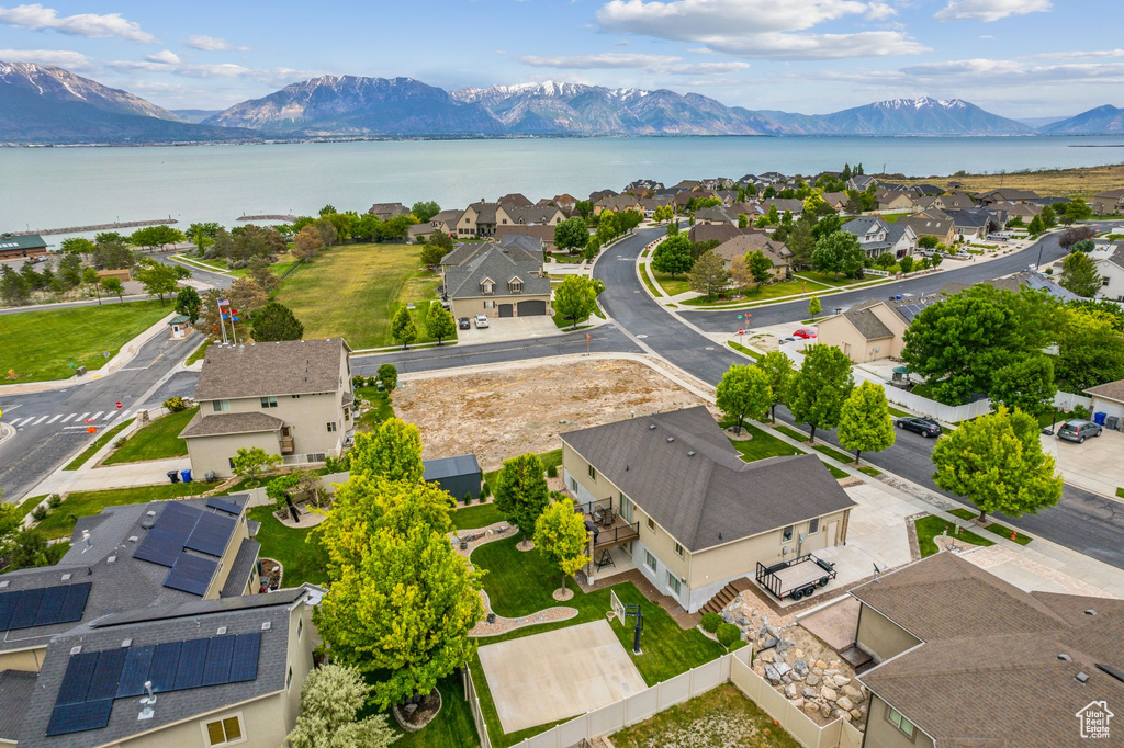Aerial view of residential area featuring a water and mountain view