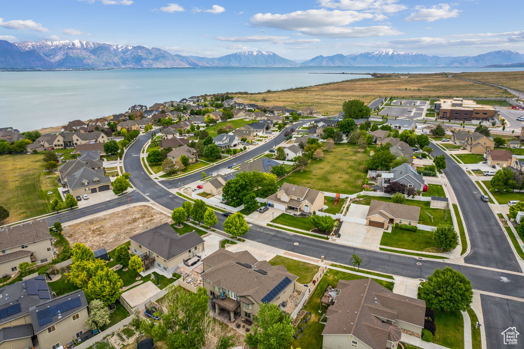 Aerial perspective of suburban area featuring a water and mountain view