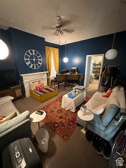 Living room with ceiling fan and carpet flooring