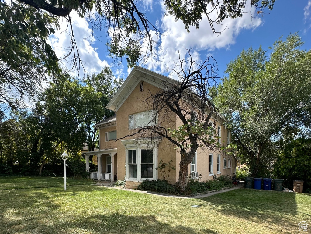 View of home\'s exterior with a lawn