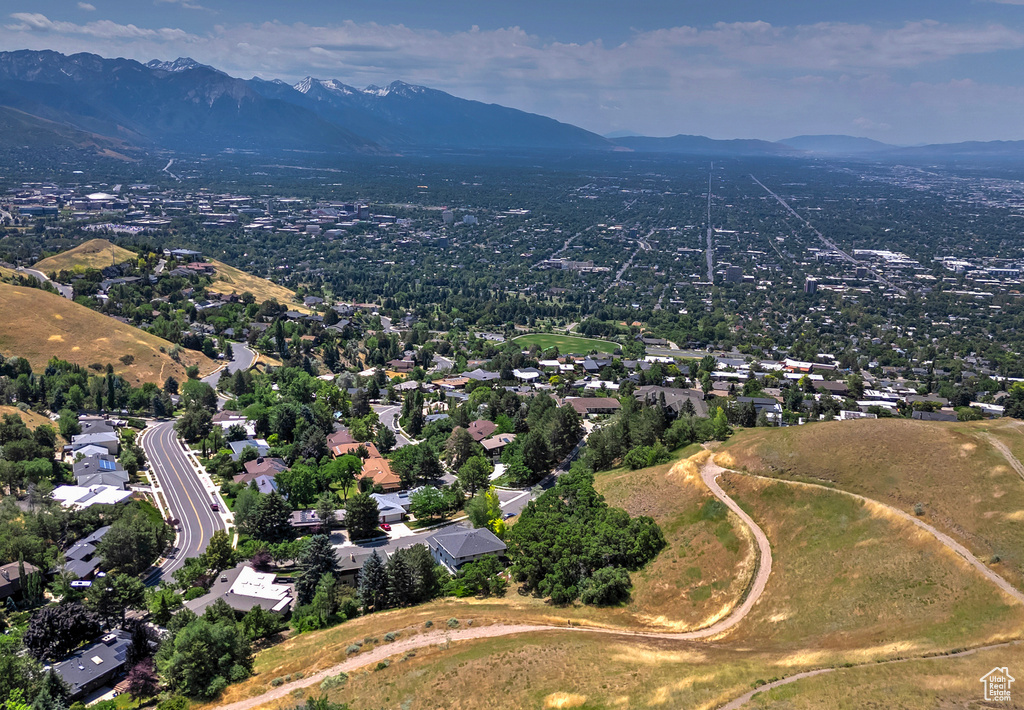 Birds eye view of property with a mountain view