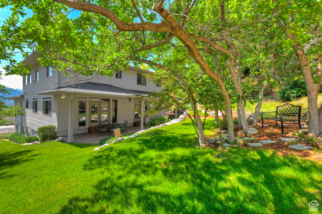 View of yard with a patio