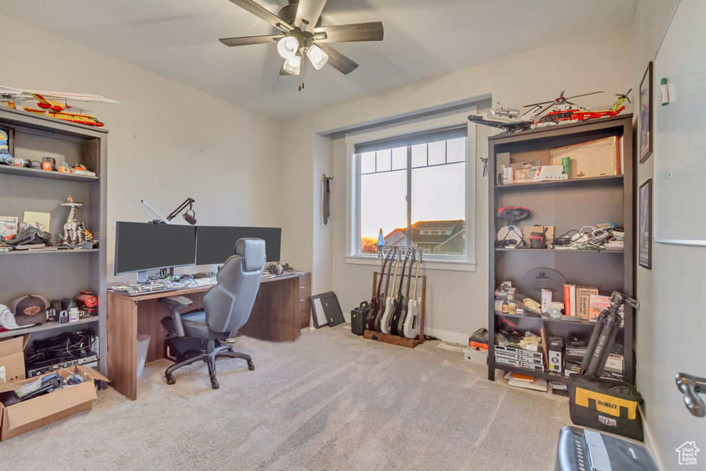 Office with ceiling fan and carpet