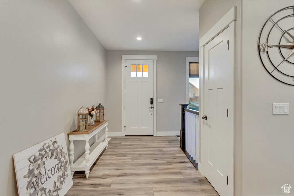 Foyer entrance featuring light hardwood / wood-style flooring