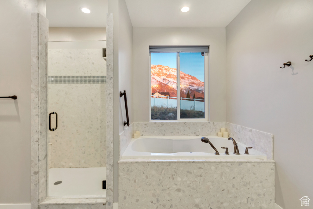 Bathroom featuring separate shower and tub