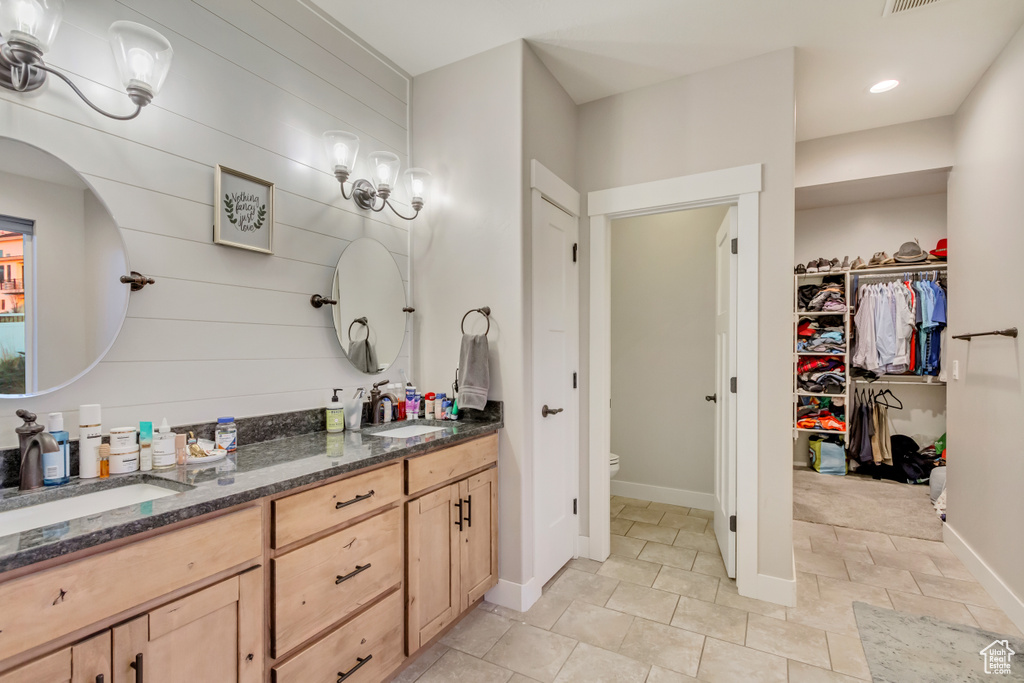Bathroom with vanity and toilet