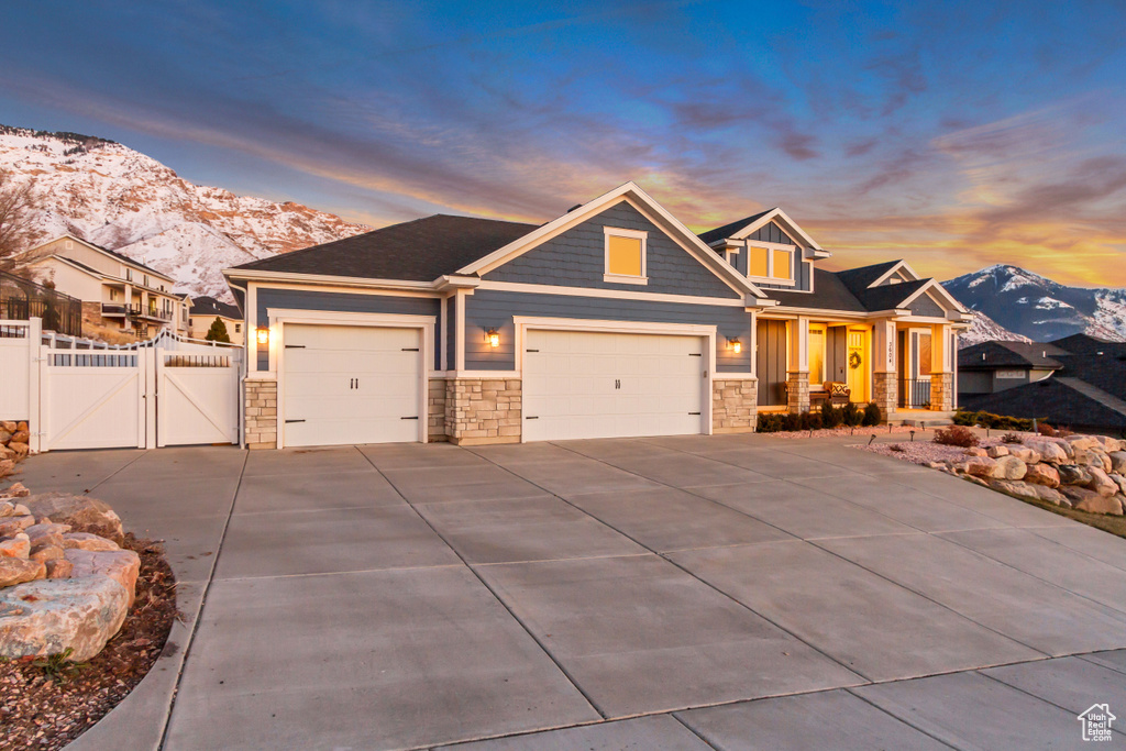 Craftsman house with a garage and a mountain view
