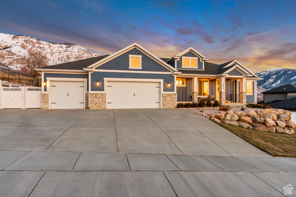 Craftsman-style home with a mountain view and a garage
