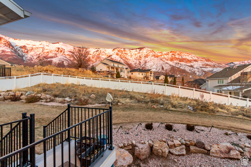 Yard at dusk with a mountain view