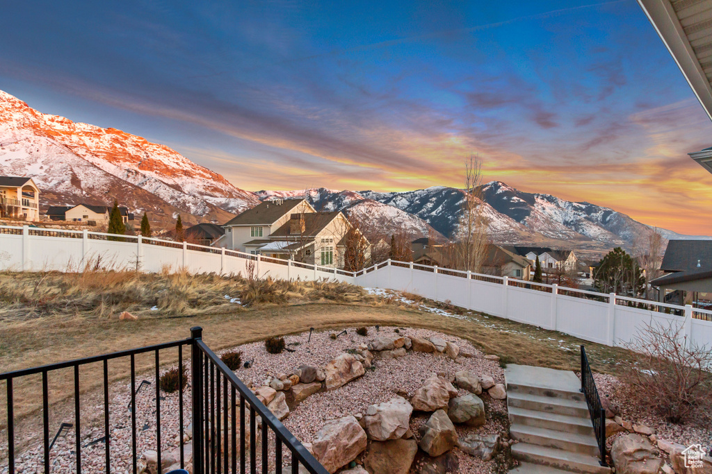 Yard at dusk with a mountain view