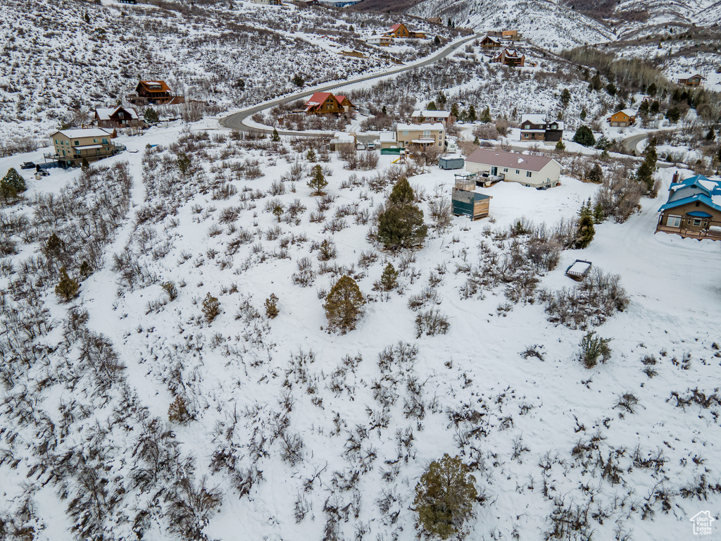 Snowy aerial view with a mountain view