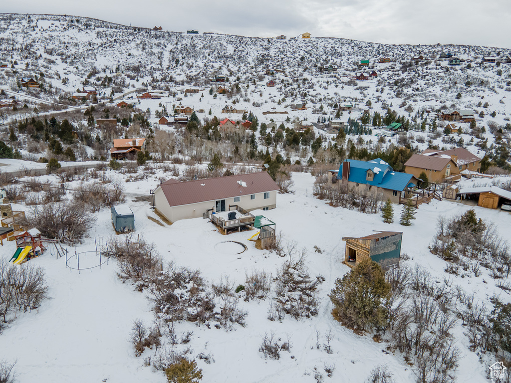 Snowy aerial view with a mountain view