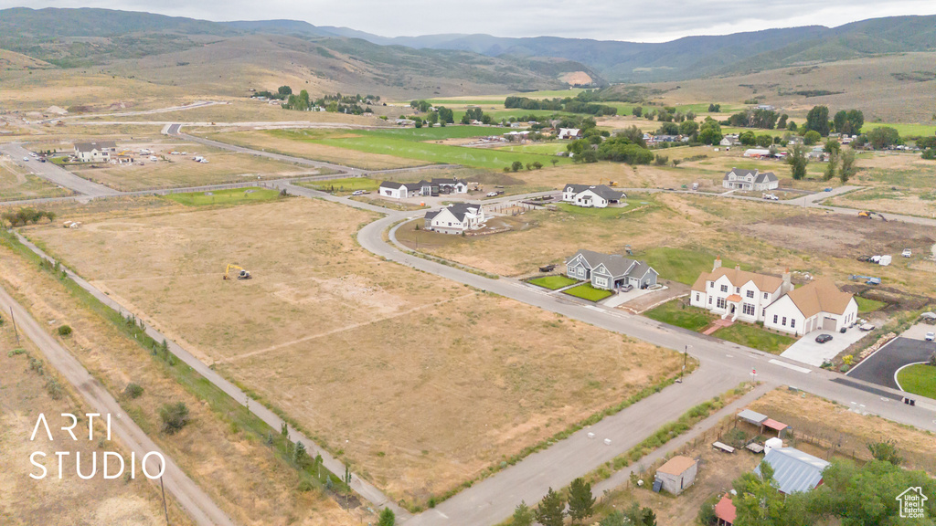 View of property location featuring a mountain backdrop and rural landscape
